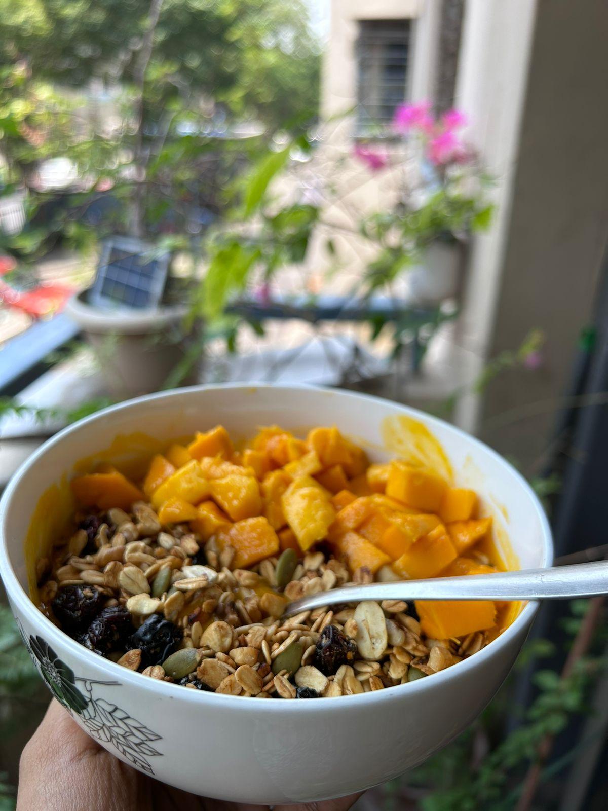 A bowl of Healthy Mango Smoothie with Tarth's Eternal Bliss Granola.